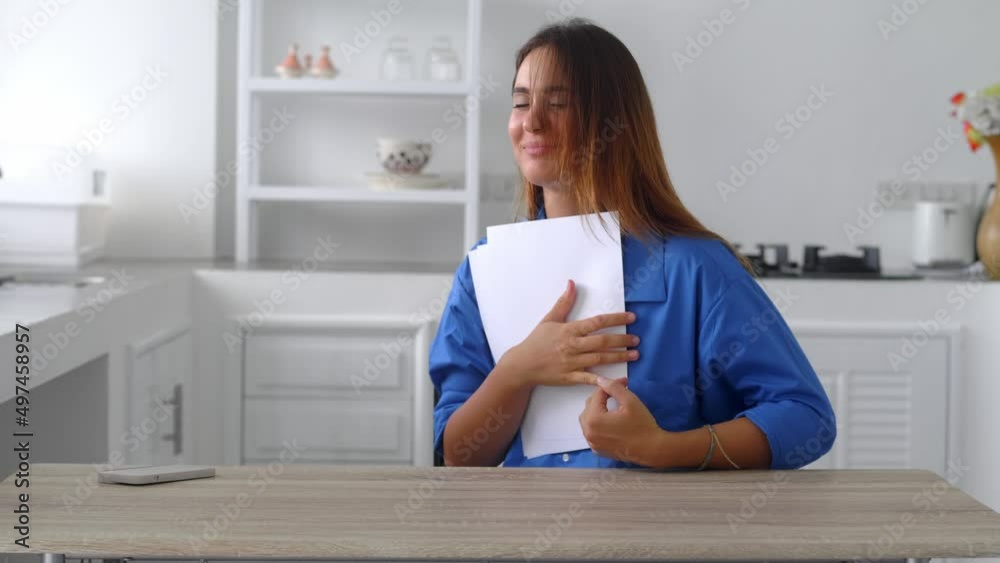 Young caucasian woman getting mail feel excited with job offer being hired accepted to college university. Amazed millennial female read great news in official letter Young caucasian woman getting mail feel excited with job offer being hired accepted to college university. Amazed millennial female read great news in official letter