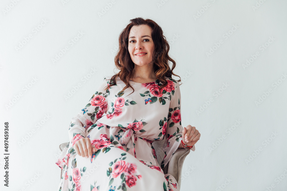 beautiful brunette woman in a summer dress with flowers beautiful brunette woman in a summer dress with flowers