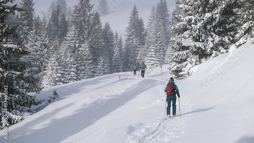 Ski touring skiers in Bucegi Mountains on a beautiful sunny day © roibu