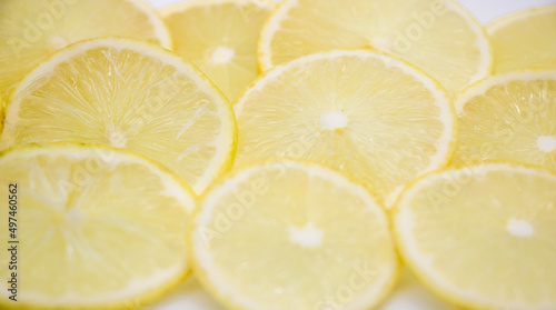 Yellow lemon slices pattern texture background. selective focus