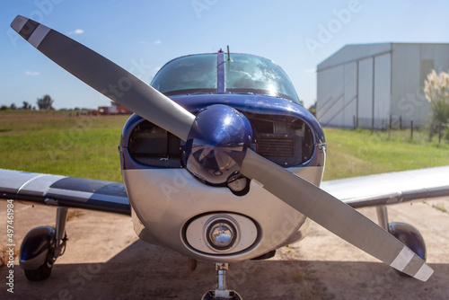Close-up front view of engine and propeller of single-engine light aircraft