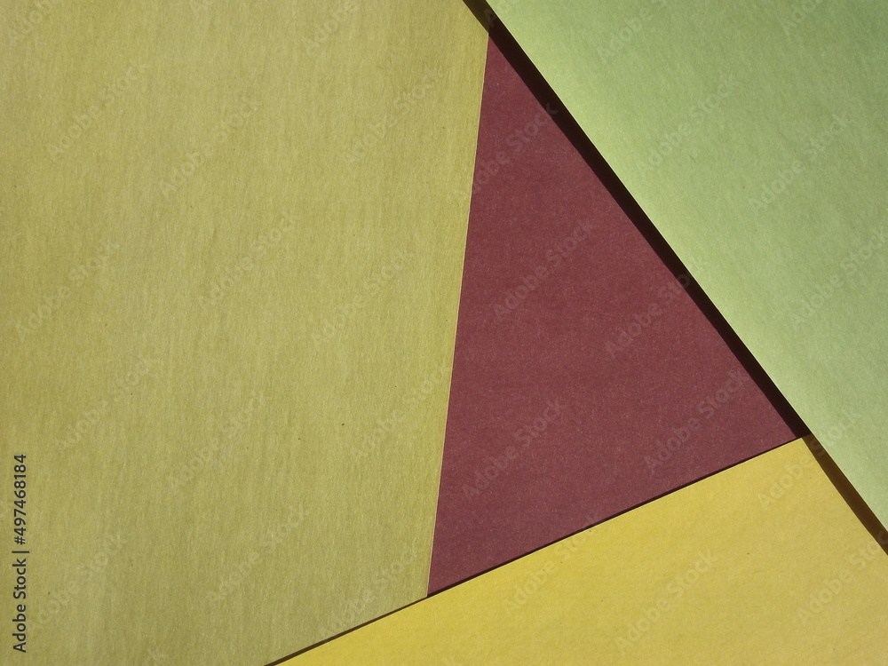 Background surface made of green and red paper Background surface made of green and red paper