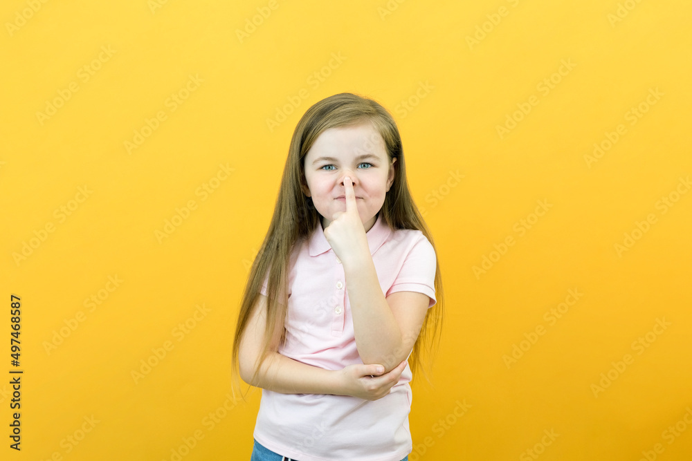 Little girl is funny, smiles and shows a pig nose Little girl is funny, smiles and shows a pig nose