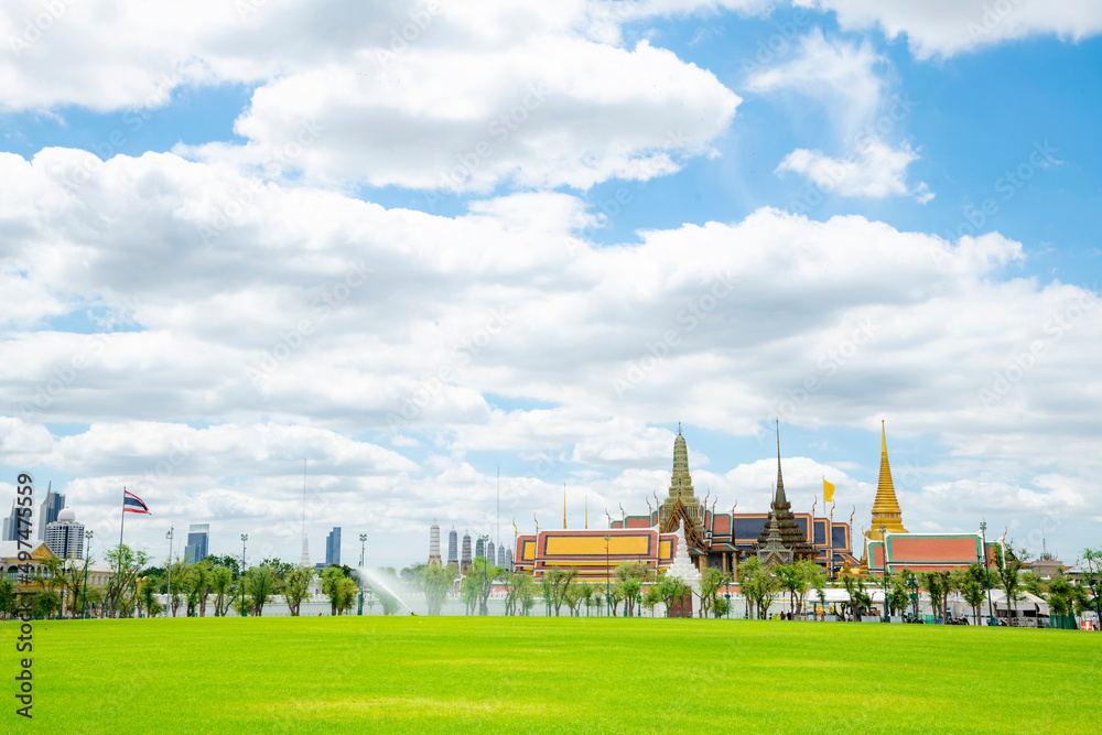 Panorama landscape of Grand palace or well known among tourist as Temple of the Emerald Buddha or local known Wat phra keaw at on a cloudy blue sky day at Bangkok, Thailand.For use as Thai Backaground