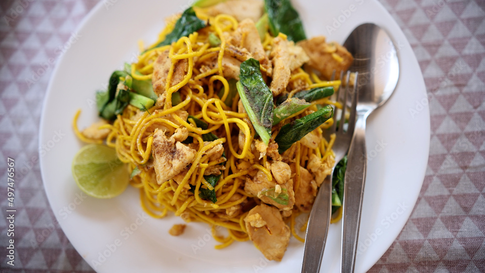 Stir-fried yakisoba yellow noodles with chicken. Stir-fried yellow noodle