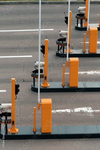 Automatic barriers with video cameras at the entrance to the paid parking