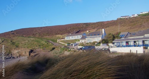 Blue Bar Restaurant Near Porthtowan Beach On A Windy Day In Cornwall, United Kingdom. Pan Left Shot photo