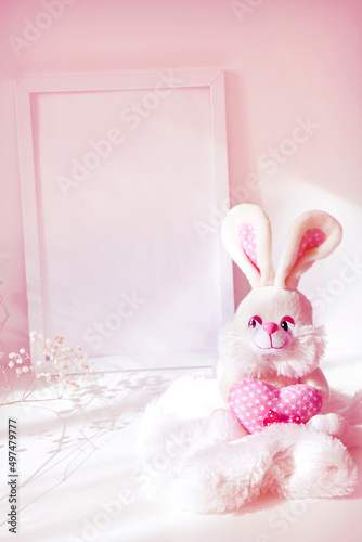 Fluffy funny toy bunny, soft stuffed toy with flower, nersery bedroom decor, photo