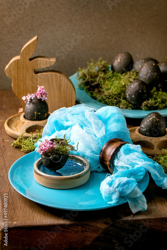 Easter table setting with empty turquoise ceramic tableware