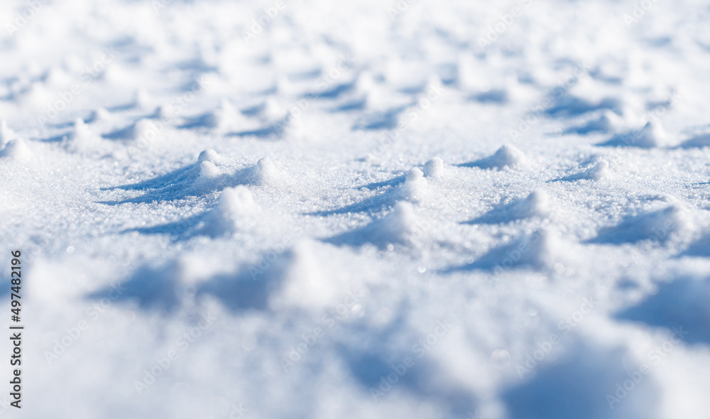 Macro view of small humps in the snow.