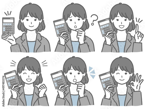 電卓を手に持つスーツの若い女性