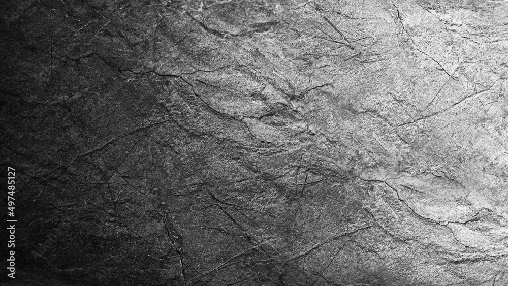Naklejka premium Black white grunge background. Gradient. Rough cracked rock surface texture. Close-up. Gray stone background with space for design.