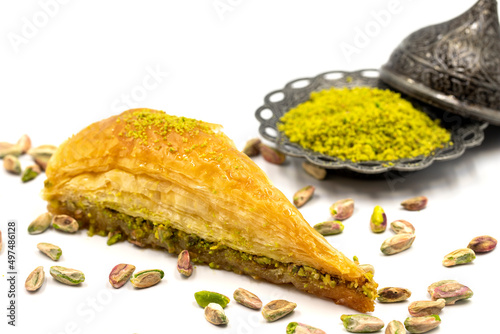 Carrot slice baklava on a white background. Traditional Mediterranean cuisine delicacies. close-up pistachio baklava. Local name havuc dilim baklava photo