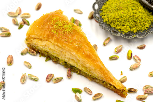 Carrot slice baklava on a white background. Traditional Mediterranean cuisine delicacies. close-up pistachio baklava. Local name havuc dilim baklava photo