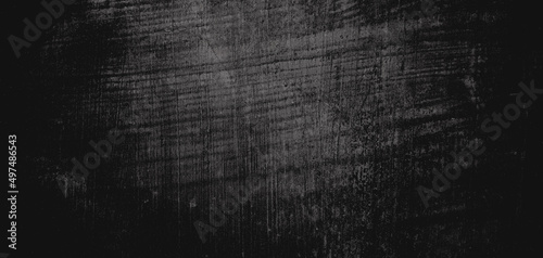 Wall full of scratches. Grungy cement texture for background, Scary dark wall.Black wall