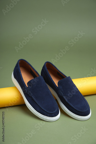 Fashion male blue shoes on green background. Fashion shoes made of eco-leather spring-summerr 2022.
