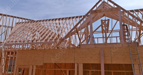 Wallpaper Mural Panorama top view of closeup new wooden roof beams built home under construction under framing with construction site Torontodigital.ca