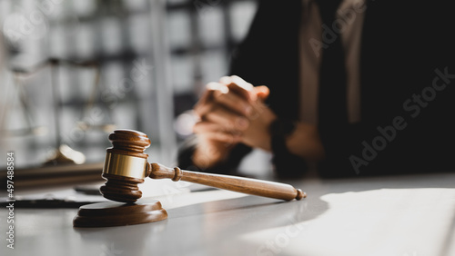 Fotografie The judge's hammer is placed on the table, the lawyer concept assumes that the defendant defends the client in order to win the case or gain the greatest benefit in accordance with the law