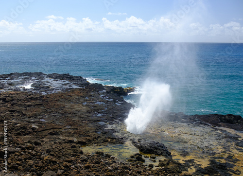 Spout of water in lava rocks