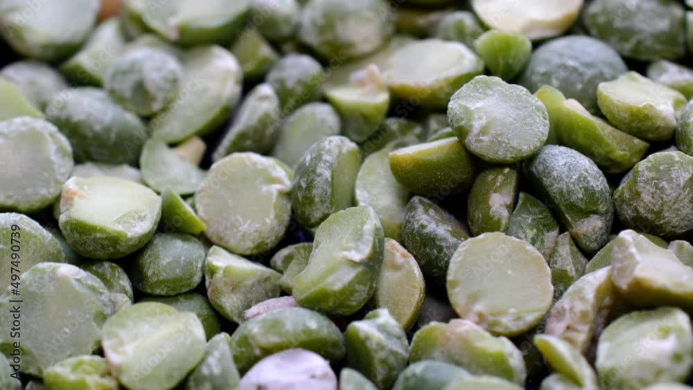 Pile of dried split green peas rotate slowly on turntable. Pile of dried split green peas rotate slowly on turntable.