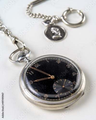 Vintage pocket watch, on white background