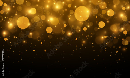 Gold bokeh blurred light. Abstract background with bokeh effect. Magic concept.