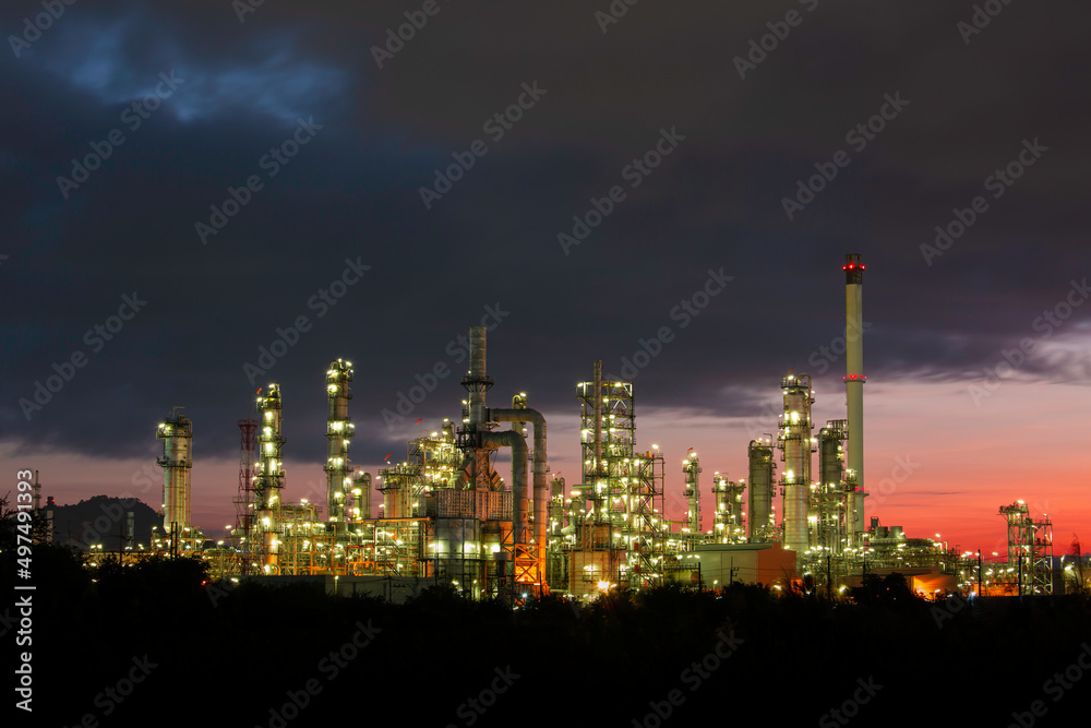 Oil​ refinery​ and​ plant and tower column of petrochemistry industry in pipeline oil​ and​ gas​ ​industry with​ sun red sky the morning