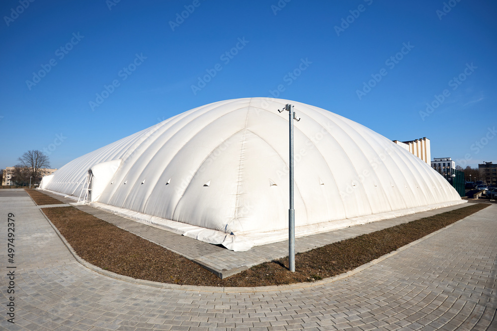 Foto Stock Inflatable air dome stadium. Inflated Tennis air dome or Tennis  bubble arena. Modern urban architecture example as pneumatic stadium dome.  | Adobe Stock