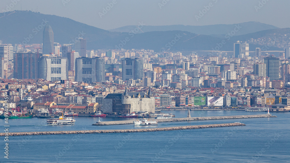 Aerial zoomed panoramic view of Kadikoy coast and Haydarpasa Train Station with the Anatolian Side architecture in the background in Kadikoy, Istanbul, Turkey on March 28, 2022.