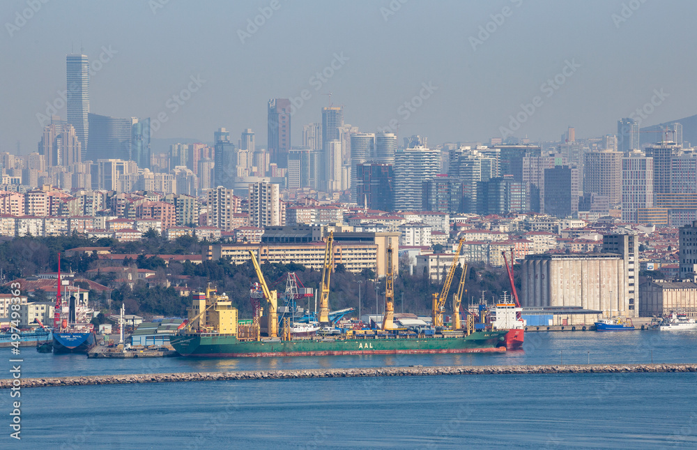 Aerial zoomed panoramic view of Kadikoy coast and the Haydarpasa Port with the Anatolian Side architecture in the background in Uskudar, Istanbul, Turkey on March 28, 2022.