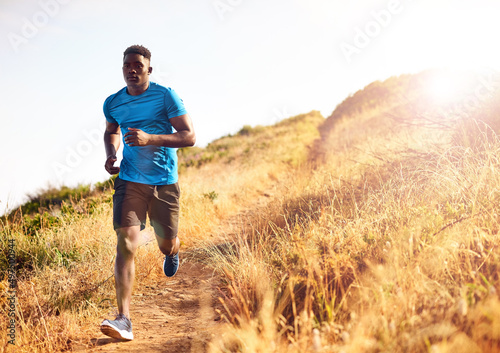 Make fitness your focus. Shot of a sporty young man out for a run. © Lyndon S/peopleimages.com