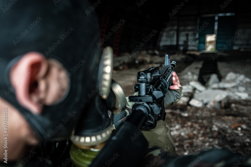 Soldier aiming a rifle