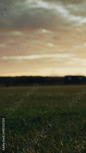 Vertical Screen. Cinematic American Football Kickoff Game Start. Static Close-up of Ball Being Kicked by the Professional Player. Gates Goal Kick. Successful Team Scores and Wins Championship photo