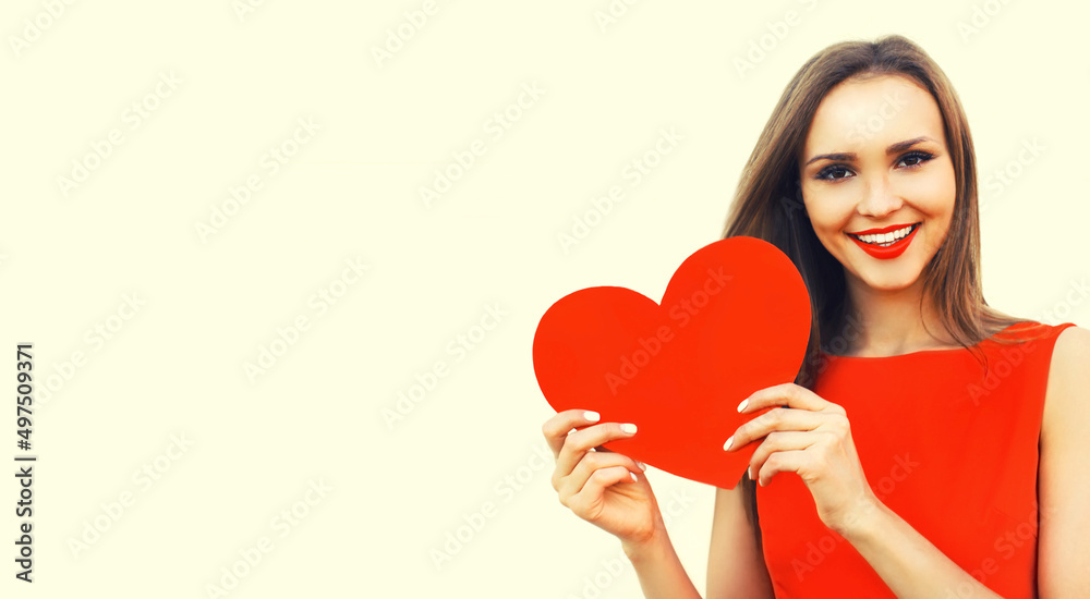 Portrait of beautiful happy smiling woman with red lipstick holding paper red heart on white background, valentines day, banner blank copy space for advertising text Portrait of beautiful happy smiling woman with red lipstick holding paper red heart on white background, valentines day, banner blank copy space for advertising text