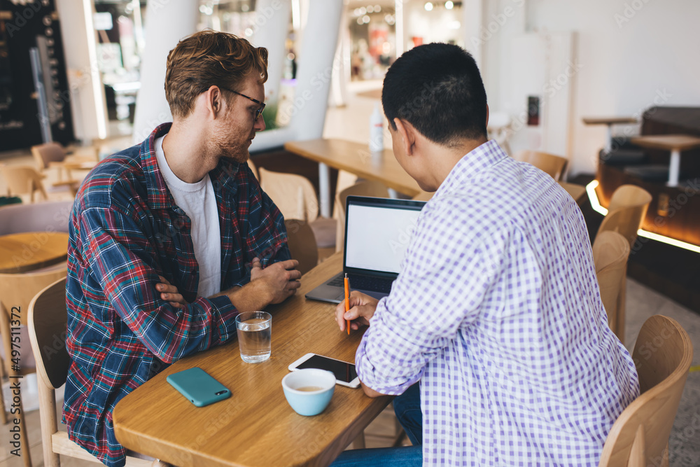 Multiracial business men working in office space Multiracial business men working in office space