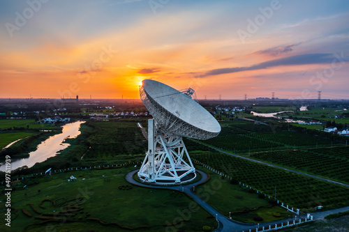 Aerial view of astronomical radio telescope at sunset