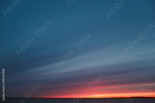 Colorful cloudy sky at the sea at sunset. Gradient color. Sky texture. Beautiful abstract nature sunset as background