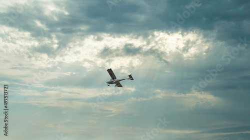 Small plane under an overcast sky