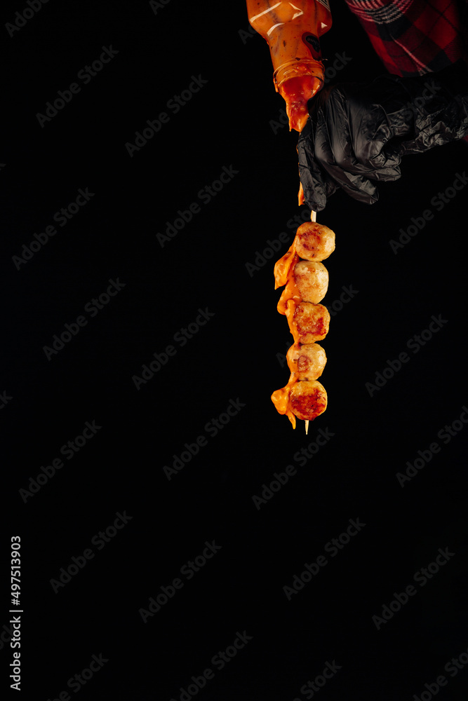 Fototapeta premium meatballs on a white plate on a black background