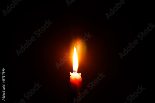 light a candle in a dark room