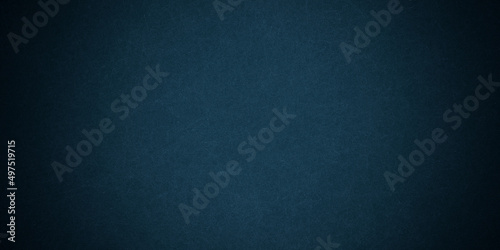 Dark blue background texture with black vignette in old vintage grunge textured border design, dark elegant teal color wall with light 