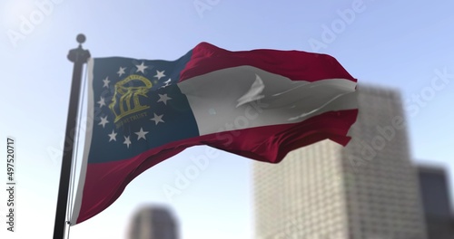 Georgia state waving flag on blurry background, USA state news illustration. Blurry background