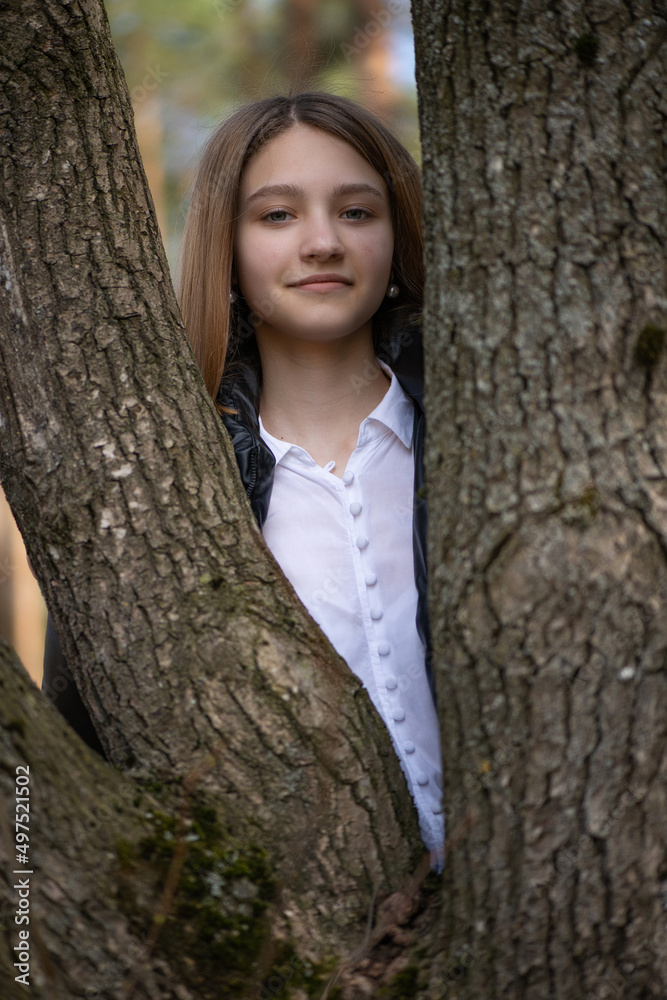Portrait of a young beautiful fair-haired girl in a summer forest. Portrait of a young beautiful fair-haired girl in a summer forest.