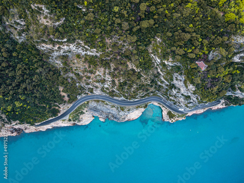 Aerial view of Aurelia street in Noli, Capo Noli and Varigotti, province of Savona. Drone photography from above of snake street snake in Liguria, north Italy, near Bergeggi and Spotorno.