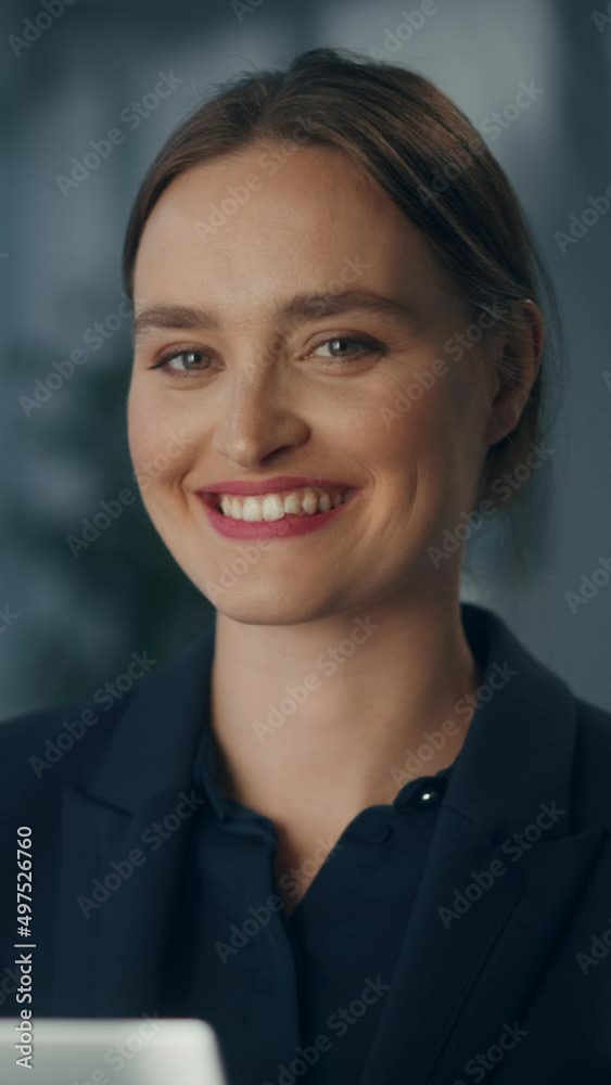 Vertical Portrait of Beautiful Businesswoman in Stylish Black Suit Posing Next to Window in Big City Office with Skyscrapers. Confident Female CEO Smiling. Successful Diverse Business Manager. Vertical Portrait of Beautiful Businesswoman in Stylish Black Suit Posing Next to Window in Big City Office with Skyscrapers. Confident Female CEO Smiling. Successful Diverse Business Manager.