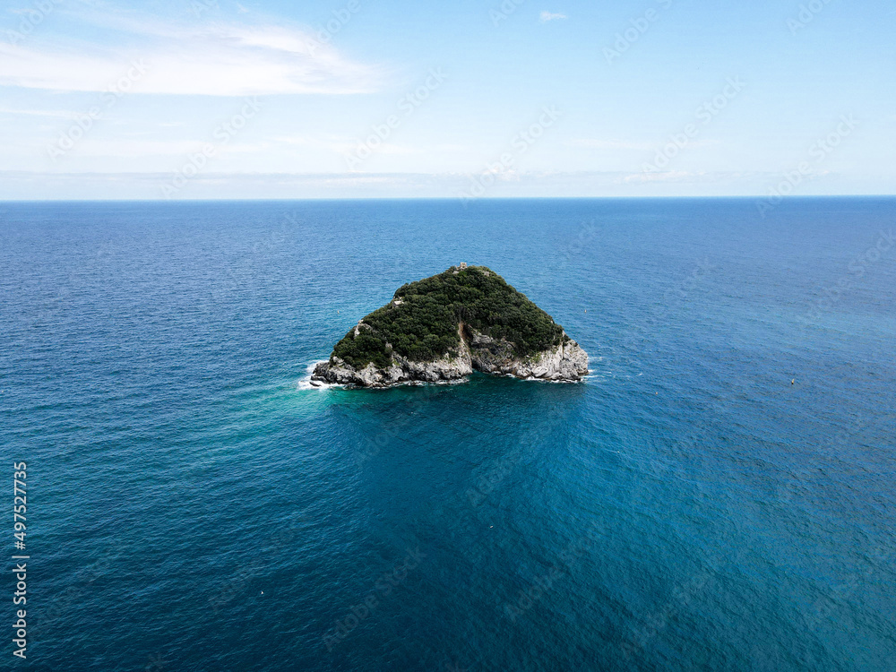Aerial view of Bergeggi island, heart island from above, in Liguria, north Italy. Drone photography of the Ligurian coast, province of Savona with Spotorno and the island of Bergeggi. Aerial view of Bergeggi island, heart island from above, in Liguria, north Italy. Drone photography of the Ligurian coast, province of Savona with Spotorno and the island of Bergeggi.