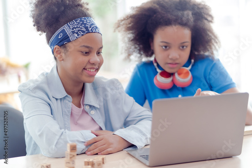 African American female students Two of them are setting up online classes via The internet were hit by both of them with great intentions to study today. Makes learning very understandable.