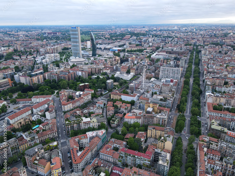 Milan, Italy - May 08, 2021: Aerial view of Milan Porta Nuova district, city skyline, business buildings and skyscrapers of Palazzo Regione Lombardia, Unicredit Tower, Bosco Verticale in Lombardy.