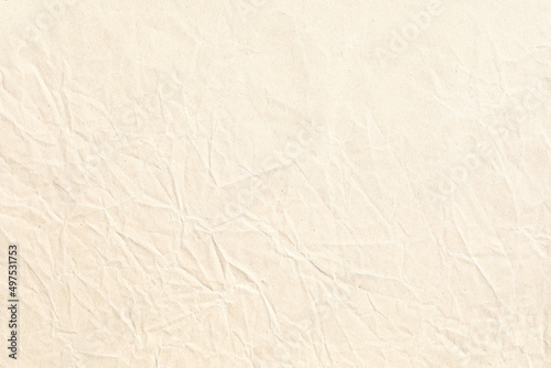 Pale brown crumpled paper background texture