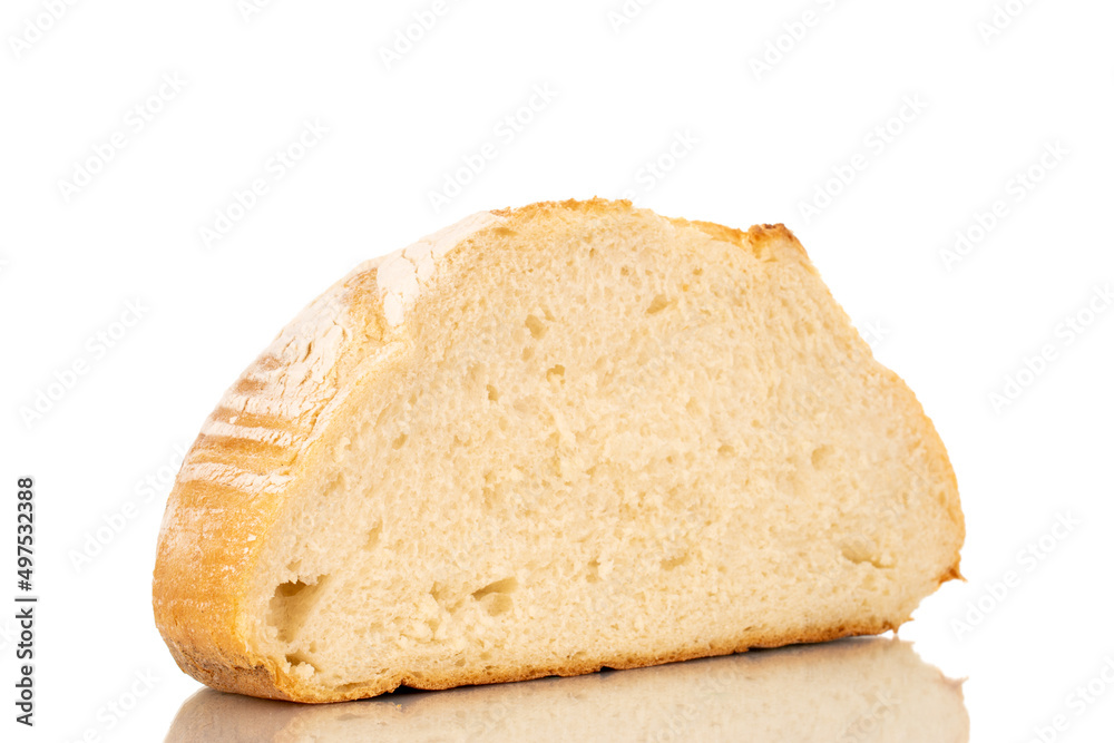 One half of a loaf of fresh fragrant white wheat bread, macro, isolated on a white background.